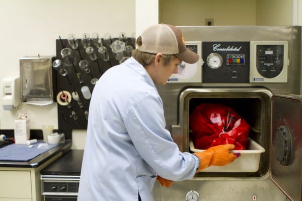 The MSR water lab is an EPA-registered Biosafety Level 2 lab, meaning it can buy and grow its own pathogens. Zac places biohazard material in the autoclave for sterilizing. 