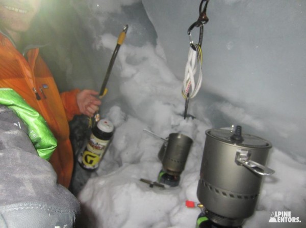 Alpine Mentee Colin Simon squeezes out a smile in the crevasse kitchen.