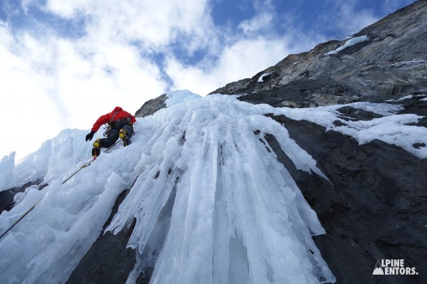 Mentee Buster Jesik leading a classic steep-ice pitch on “French Realty,” Canadian Rockies