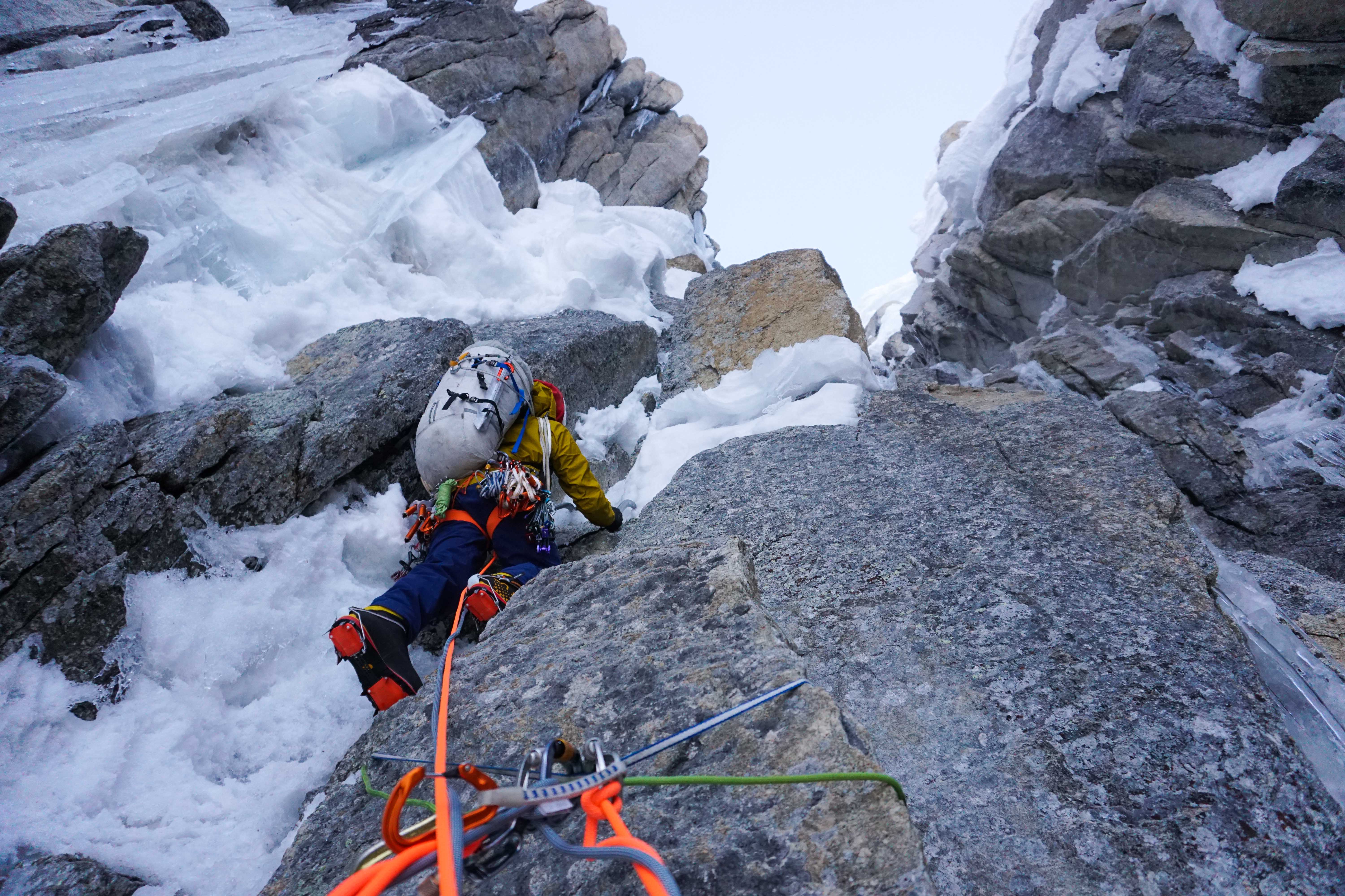Wright launching into the lower mixed crux at the start of the first night on route