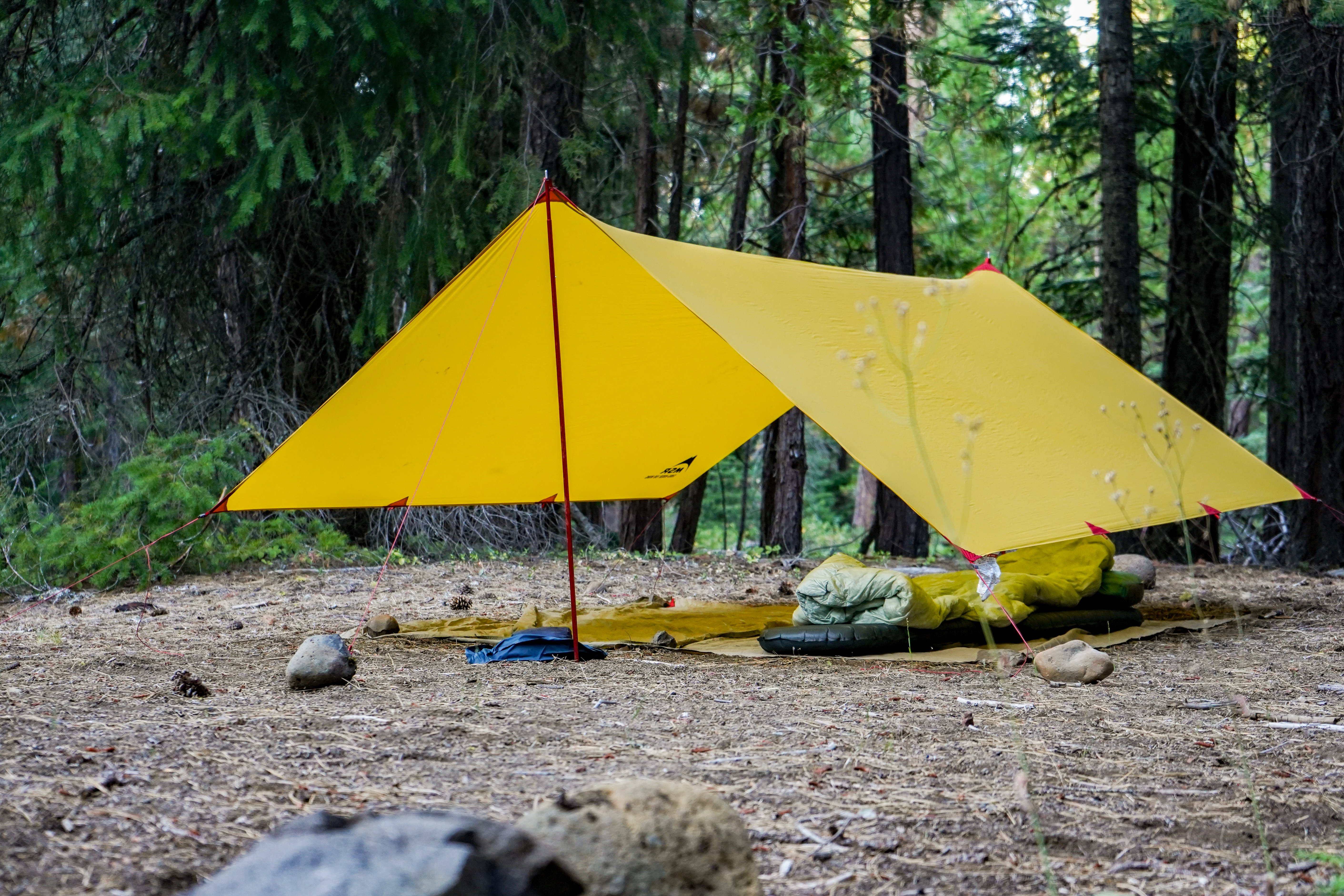 Minimal shelter tarp while camping