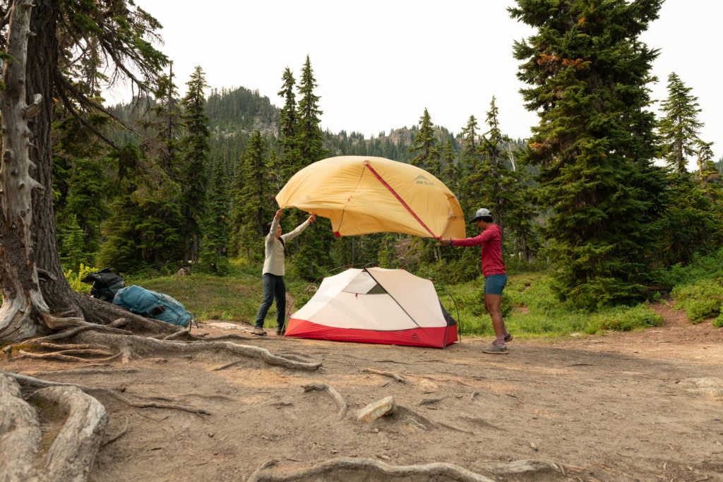 putting rainfly on backpacking tent