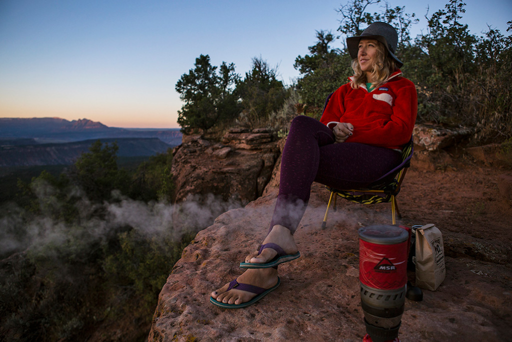 Woman cooking backcountry meal in MSR Windburner Stove