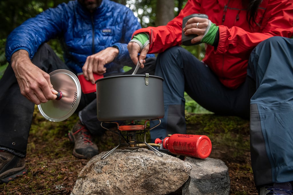 cooking with liquid fuel stove on backpacking trip