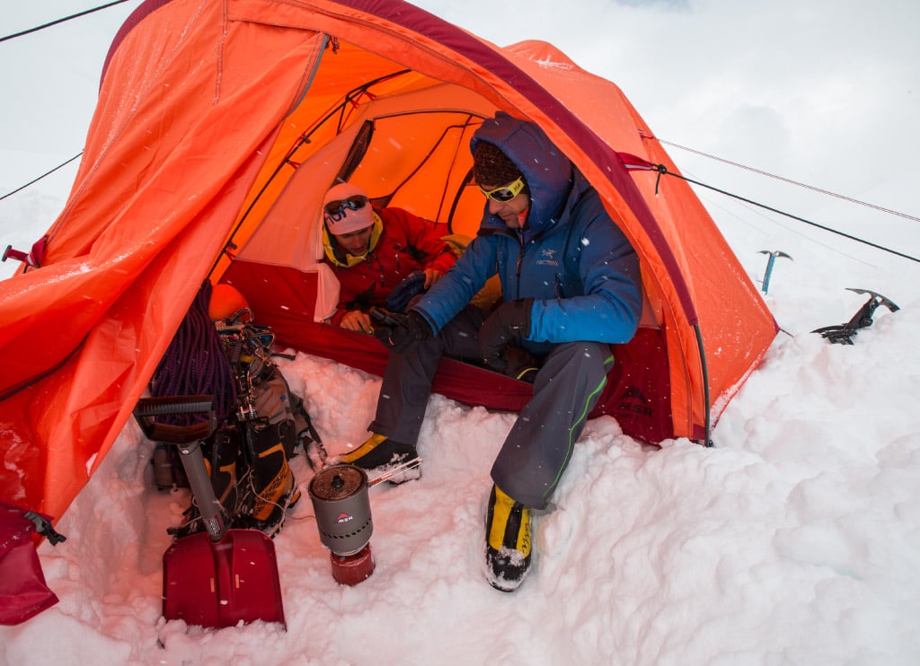 Alpine climber uses MSR Ractor Stove to cook meal