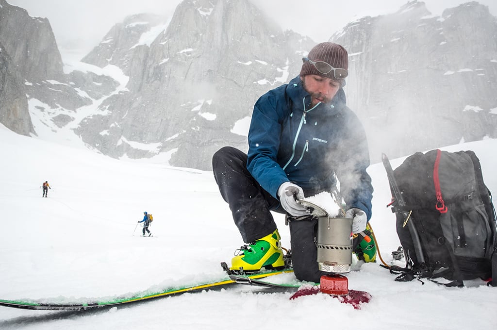Backcountry skier melts snow with MSR Reactor Stove