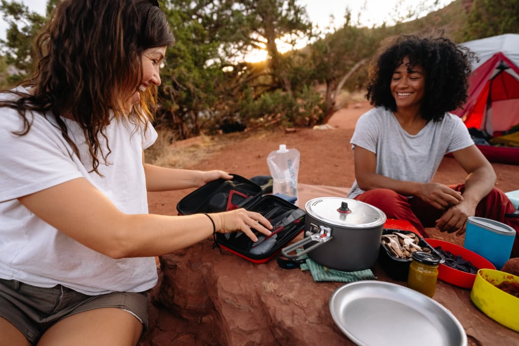 Backpackers setting up camp kitchen