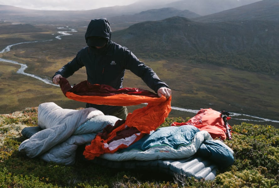 Backpacker sets up sleeping system with Pro Bivy and Therm-a-Rest sleeping bag and mattress