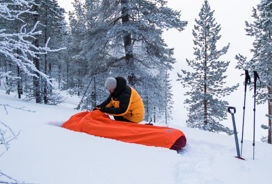 Winter backpacker prepares MSR Pro Bivy