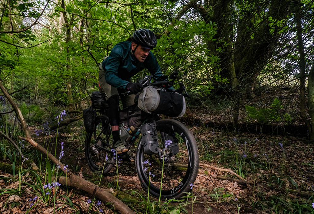bikepacking through wooded area in Europe