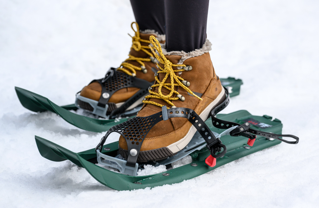 Putting on Evo Trail Snowshoes