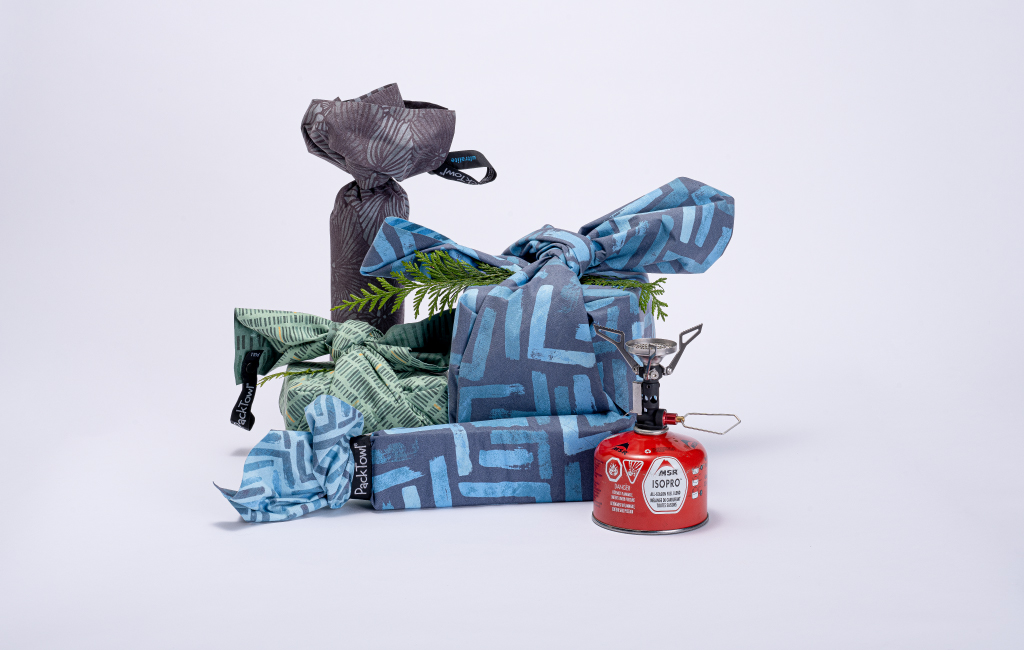 Collection of Furoshiki wrapped gifts and MSR PocketRocket Stove
