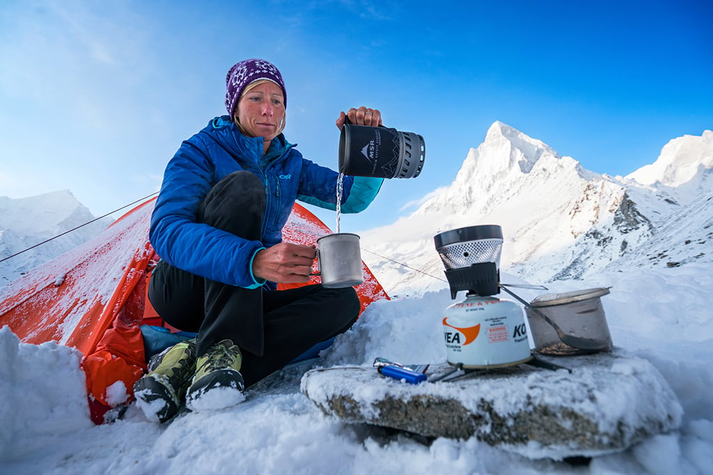 Using the camp stove in high altitude camp after a night of fresh snow.