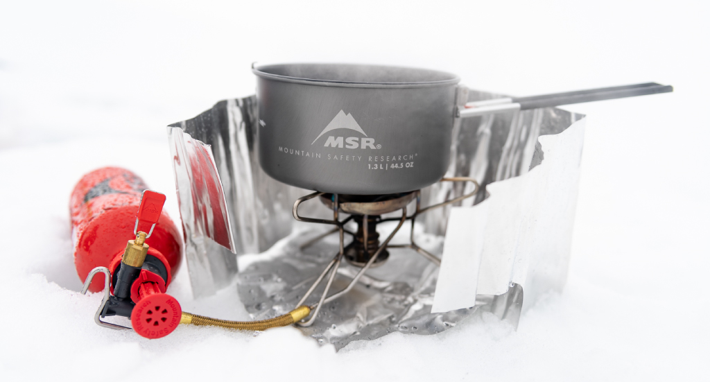 MSR liquid fuel stove, heat reflector with windscreen